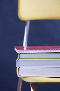 Close up of books stacked on chair