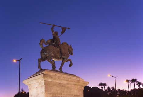 Spain, Andalusia, Seville, Statue against clear sky at dusk