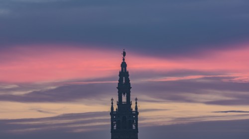 Spain, Andalusia, Seville, Bell tower of La Giralda against romantic sky