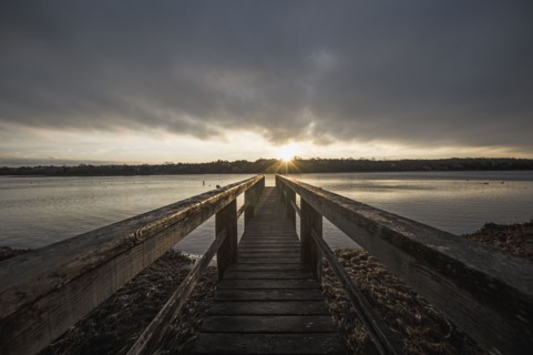 USA, Massachusetts, Eastham, Cape Cod, View from jetty on lake at sunrise