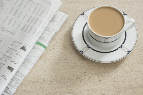 Newspaper and coffee on table