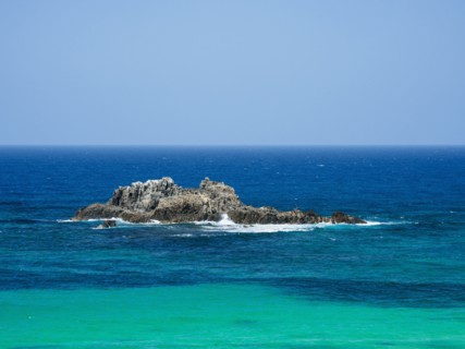 Australia, New South Wales, Bermagui, Wave splashing on rock formation in sea