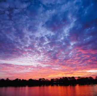 Australia, New South Wales, Bermagui, Scenic sunset above water