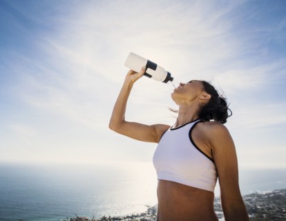 Woman drinking water from bottle
