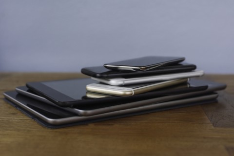 Stack of smart phones and digital tablets