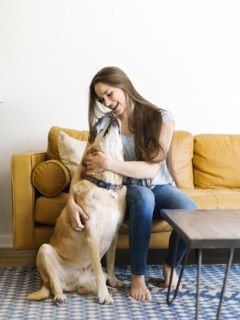 Woman on sofa with dog