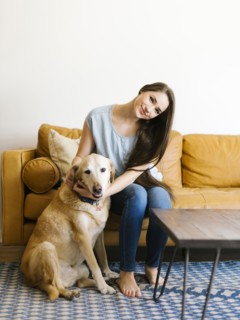 Woman on sofa with dog