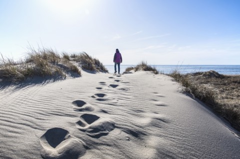 Woman walking on sand