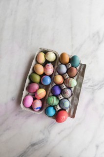 Dyed eggs in carton