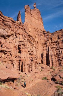 Woman hiking by Fishers Tower in Moab, Utah, USA