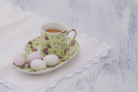 Eggs on floral plate with matching cup of tea