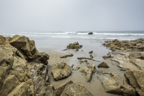 Rocks on beach in Morro Bay, California, USA