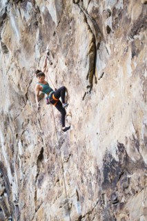 Teenage girl rock climbing
