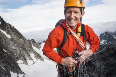 Mature man mountain climbing on Mount Stuart in North Cascade Mountains, Washington, USA