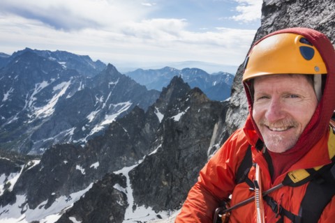 Mature man mountain climbing on Mount Stuart in North Cascade Mountains, Washington, USA