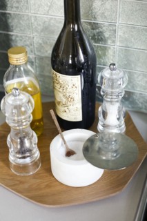 Oil, salt and pepper on tray in kitchen