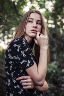 Young woman looking over shoulder