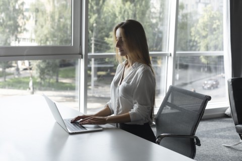 Young businesswoman working on laptop