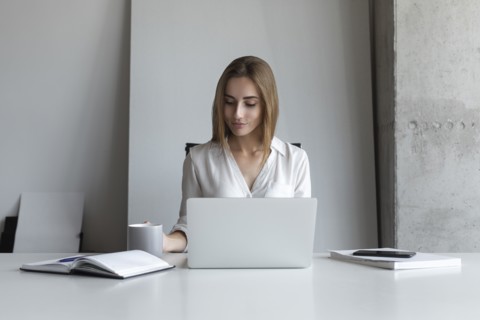 Young businesswoman working at desk