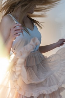 Young woman tossing her head while dancing