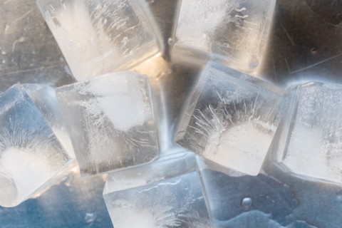Ice cubes on silver surface