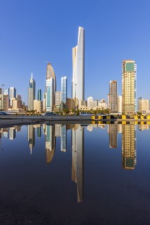 Skyline reflected in sea in Kuwait City, Kuwait