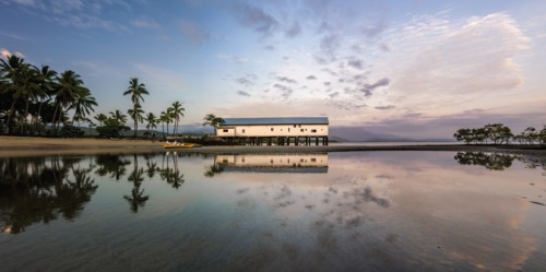 Building by beach at sunset in Port Douglas, Australia