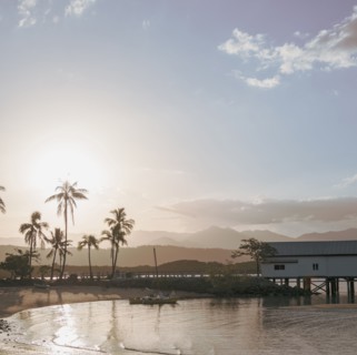 Building by beach at sunset in Port Douglas, Australia