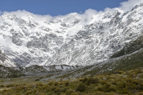 Cloud over snowcapped mountains in Mount Cook National Park, New Zealand