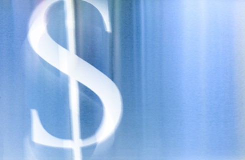 Illustration of white dollar sign against blue background