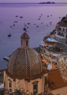 Patterned church dome at sunset in Positano on Amalfi Coast, Italy