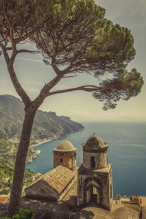 Tree over bell towers of Villa Rufolo in Ravello, Amalfi Coast, Italy