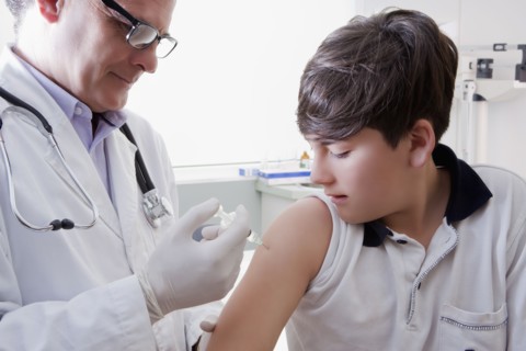Teenage boy getting vaccination
