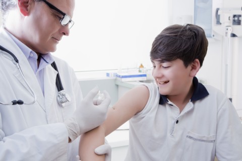 Teenage boy getting vaccination