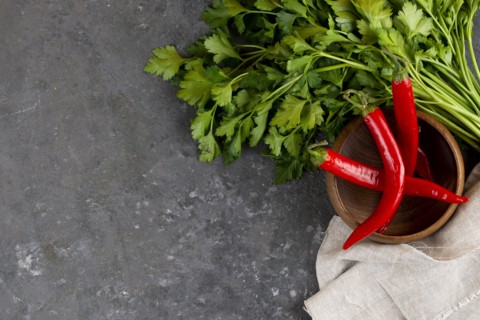 Parsley with chili peppers in bowl