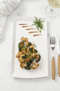 Plate of fried broccoli and cauliflower