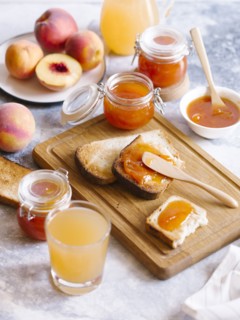 Apricot jam on toast with peaches and juice