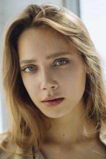 Portrait of young woman wearing natural make-up