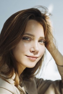 Portrait of young woman wearing natural make-up