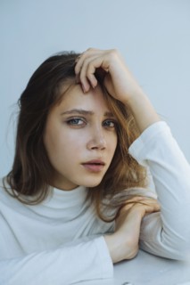 Portrait of young woman wearing natural make-up