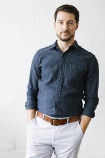 Mid adult man wearing blue button down shirt