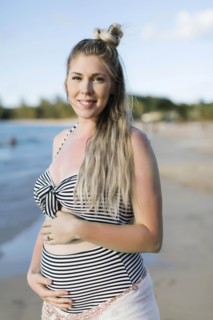 Pregnant woman on beach