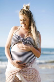 Pregnant woman on beach