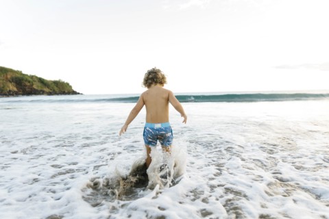 Boy playing on beach