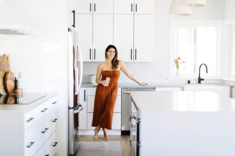 Mid adult woman smiling in kitchen
