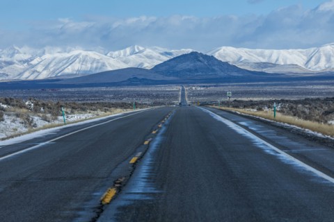 Road to snowcapped mountains in Sun Valley, Idaho, USA