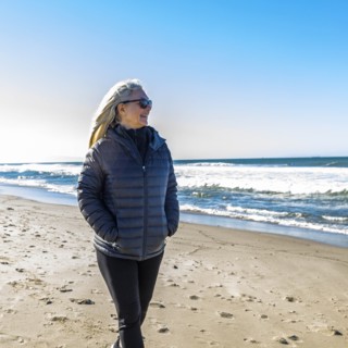 Mature woman walking on beach
