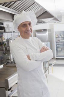 Chef smiling in commercial kitchen