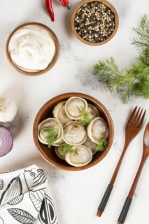 Dumplings in bowl with dill