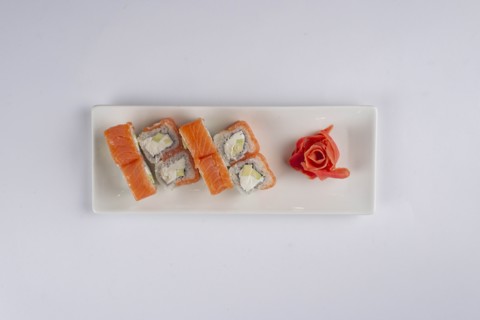 Plate of salmon sushi with pickled ginger